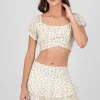 Blusa mnaga abullonada detalle liston estampada