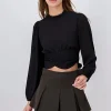 Blusa plisada manga larga abullonada