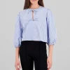 Camisa abullonada con detalle de moños