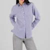 Camisa over rayas detalle abertura