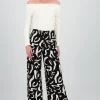 Pantalon fluido detalle estampado