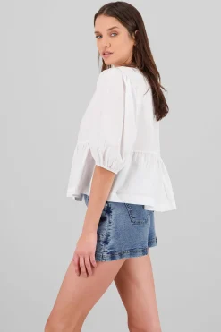 Blusa abullonada con moños lisa
