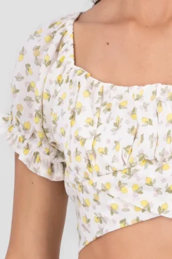 Blusa mnaga abullonada detalle liston estampada