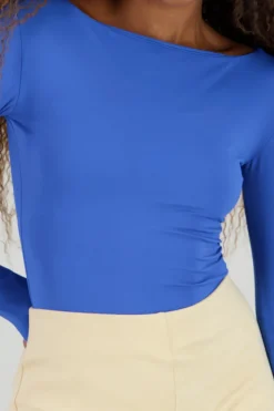 Body manga larga doble tela cuello barco