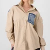 Camisa larga detalle bolsa denim