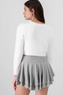 Cardigan botones moños brillos