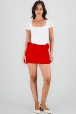 Falda con detalle de moños lisa