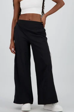 Pantalon amplio detalle franjas contraste