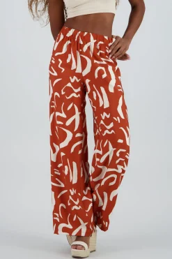 Pantalon fluido detalle estampado