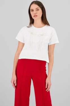 Playera manga corta detalle moños perlas