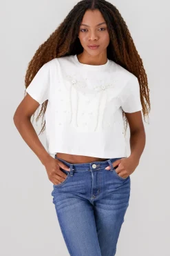 Playera manga corta detalle moños perlas