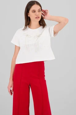 Playera manga corta detalle moños perlas