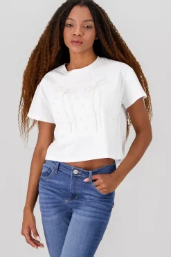 Playera manga corta detalle moños perlas
