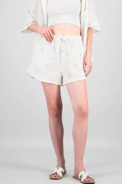 Shorts lisos con mini flores bordadas