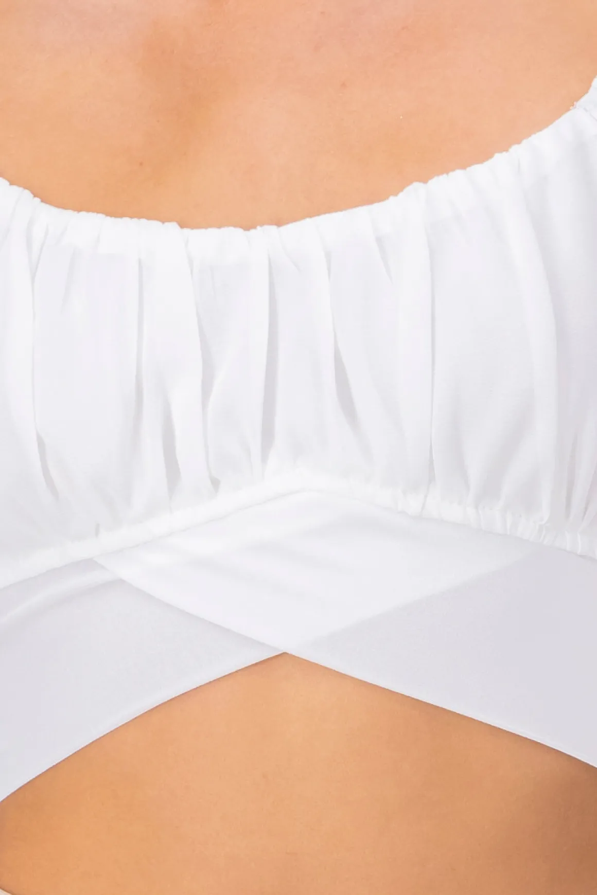 Top crop manga abullonada plisada