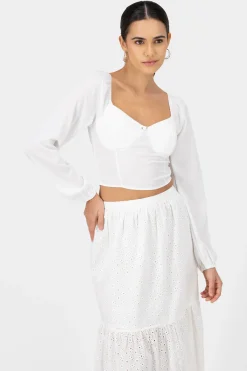 Top de manga larga con copas y detalle de rosa